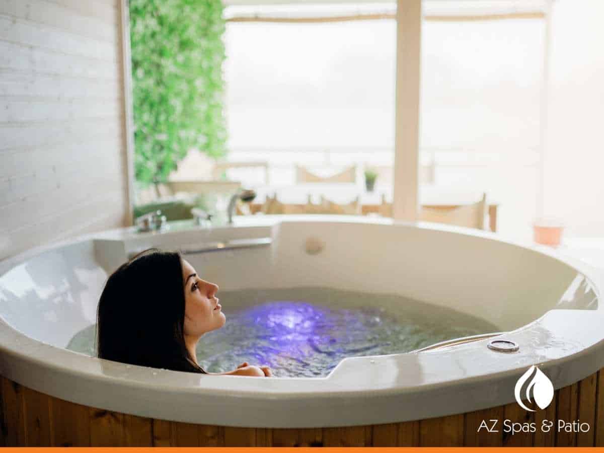 Girl enjoying a daily soak in a high-quality hot tub in Mesa, AZ